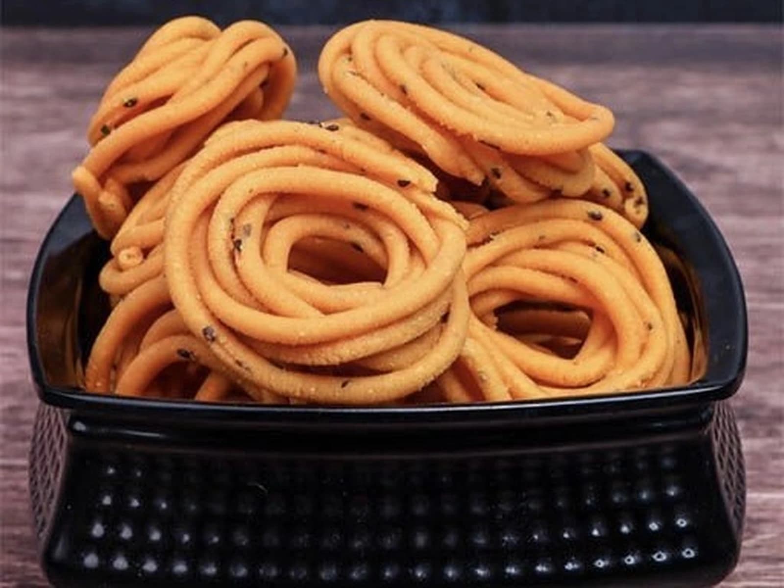 Bowl of spiral janthikalu, crunchy murukku-style rings