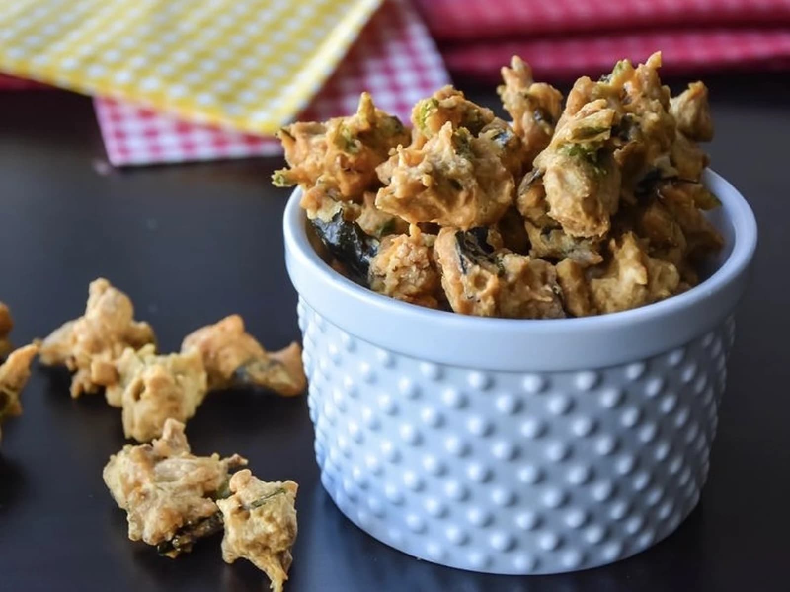 Bowl of crispy jeedipappu pakodi fritters