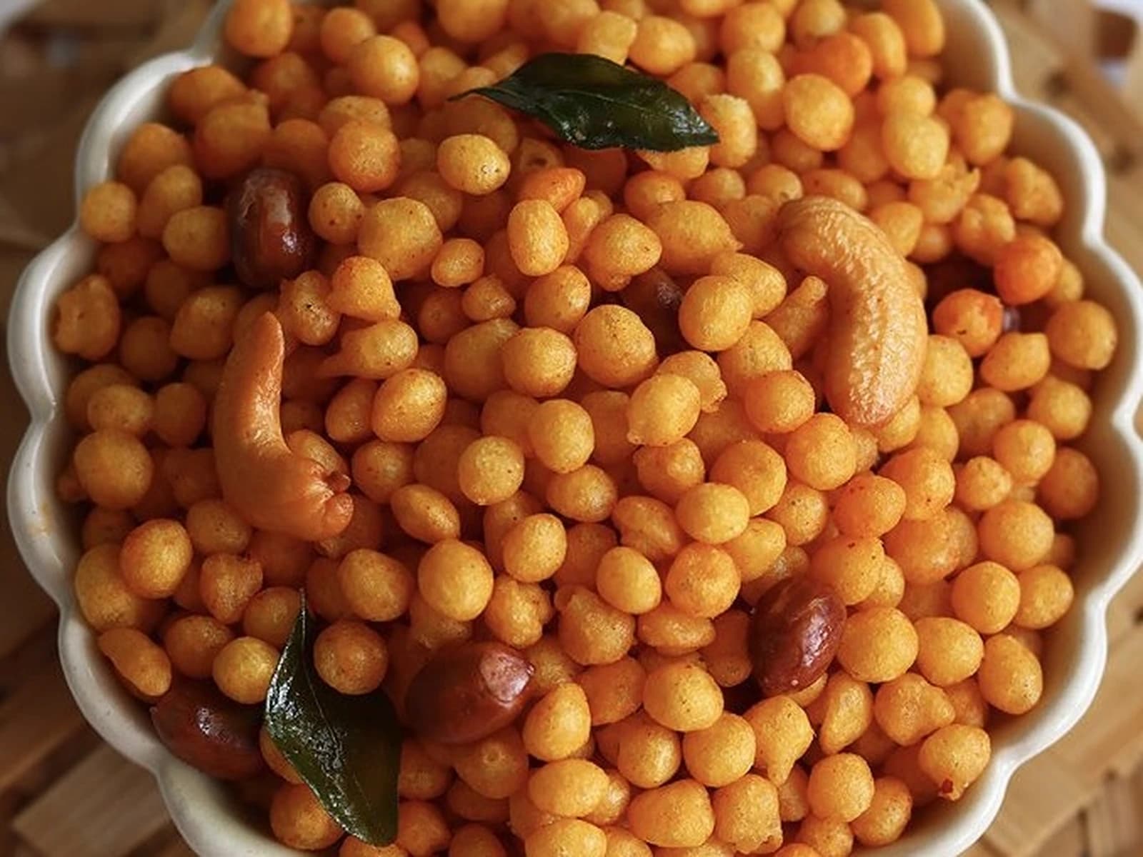 Bowl of karapu boondi with roasted peanuts, cashews, and curry leaves