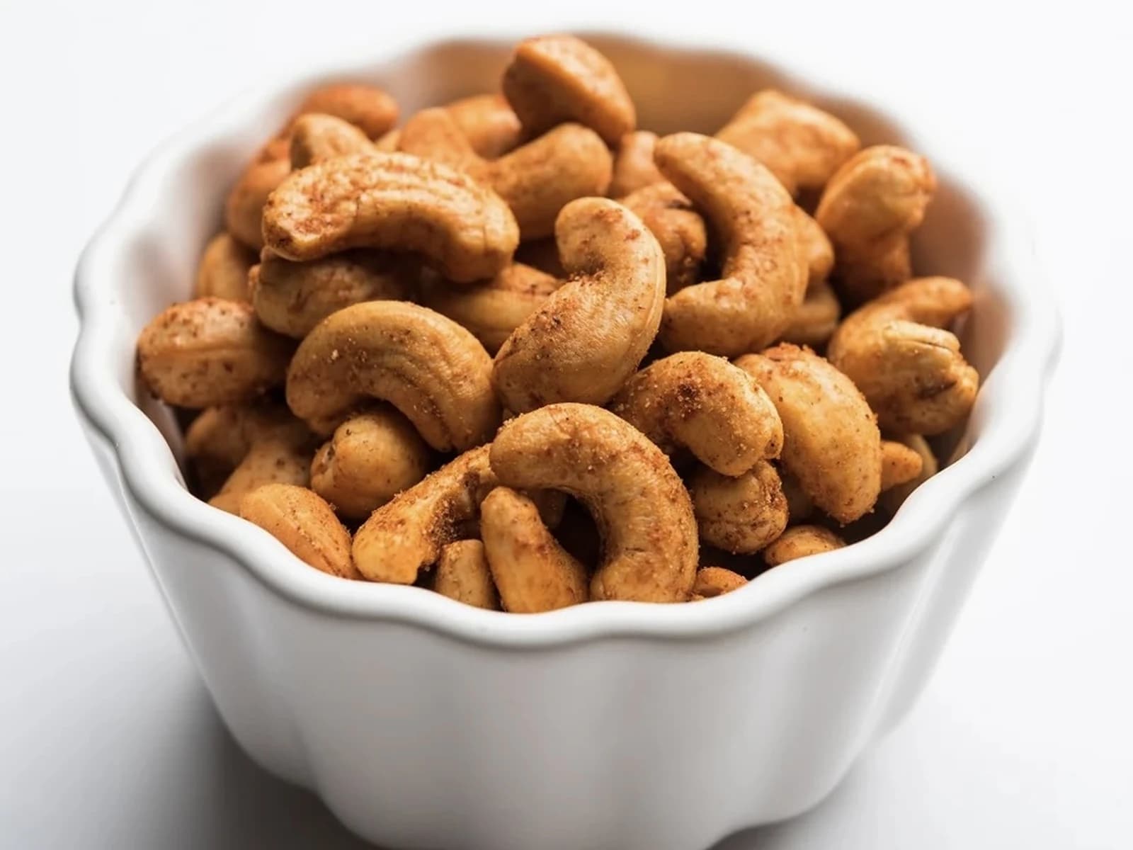 Bowl of masala jeedipappu, roasted cashews coated in spices