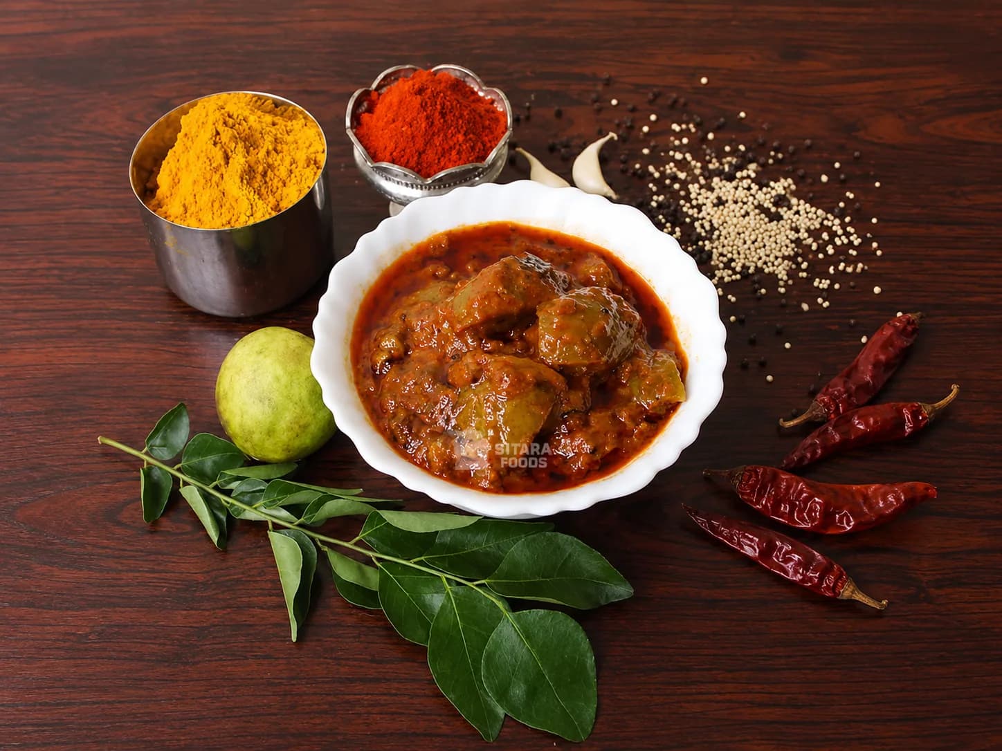 Bowl of lemon chilli pickle in spiced masala